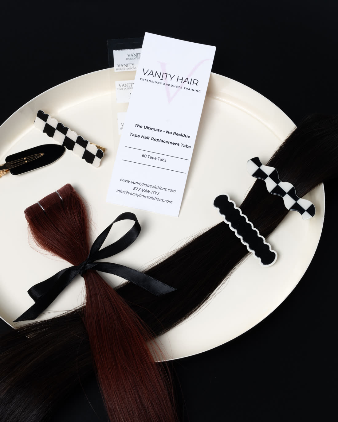 Replacement tape tab card with freshly taped tape-in wefts on a tray